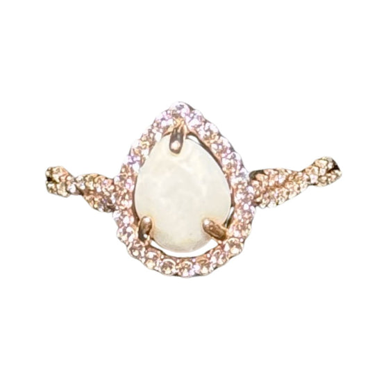 teardrop halo twist ring yellow gold with diamonds and breastmilk