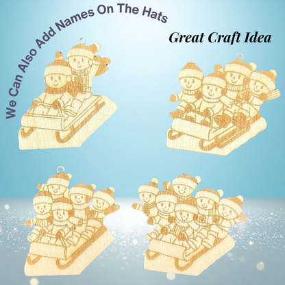Wooden Christmas ornaments with children on a sleigh on a blue background