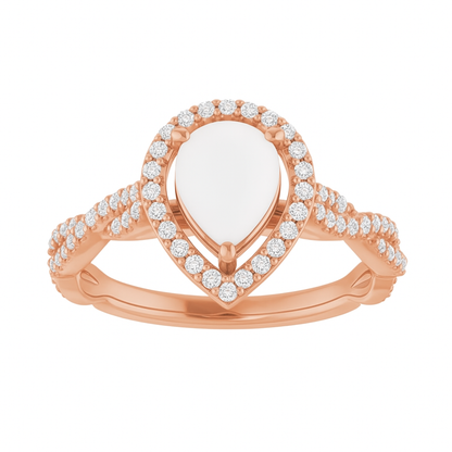 Rose gold ring with a pear-shaped center stone and diamond accents, breastmilk, breastmilk jewellery, breastmilk jewelry,  ash ring, breastmilk ring, diamond ring, diamond halo