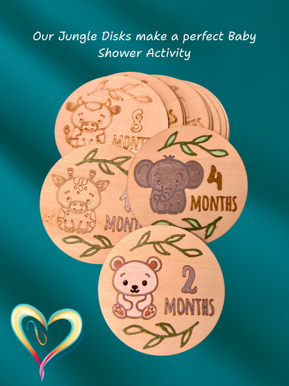 Wooden disks with animal illustrations and months printed on them, on a teal background. baby milestone