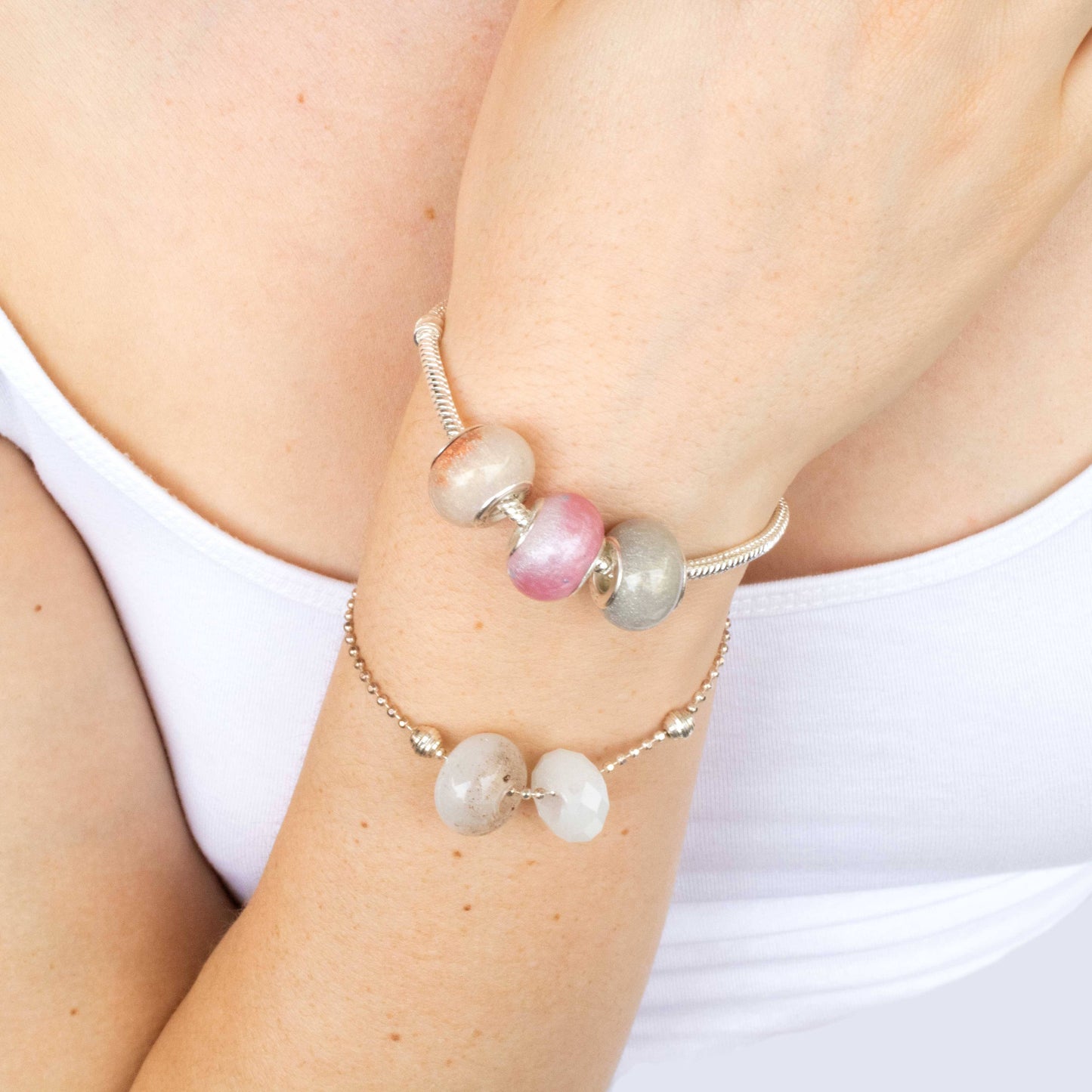 A keepsake bead or Charm made with Breastmilk, Hair, Ashes 
