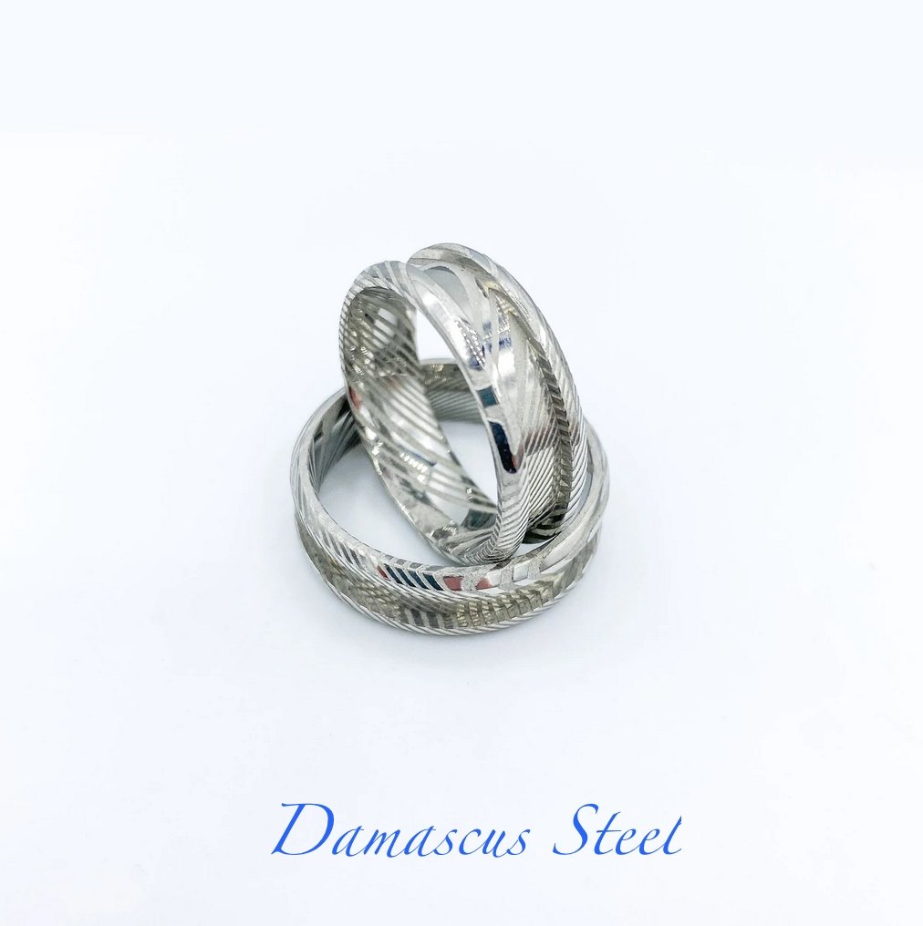 Damascus steel wedding band – durable patterned ring customisable with DNA inclusions and engraving