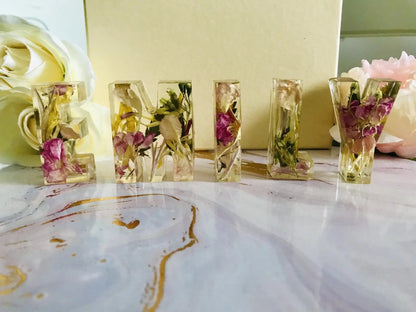 Letters - 'emily' made from funeral flowers to spell baby's name